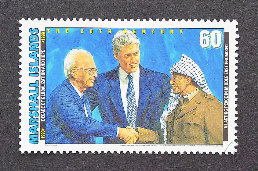 A postage stamp printed in Marshall Islands showing an image of Yitzhak Rabin, Bill Clinton and Yasser Arafat during the Oslo Accords