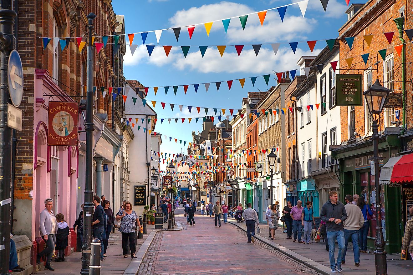 Rochester, UK: Rochester high street at weekend. People walking through the street, passing cafes, restaurants and shops