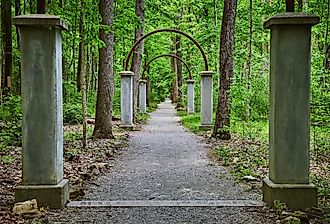 Row of concrete pillars and metal arches on Rose Island, Indiana