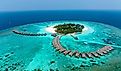 Aerial View, Maldives, North Malé Atoll, Indian Ocean, Thulhagiri Island Resort with Water Bungalows. Image credit Video Media Studio Europe via Shutterstock.