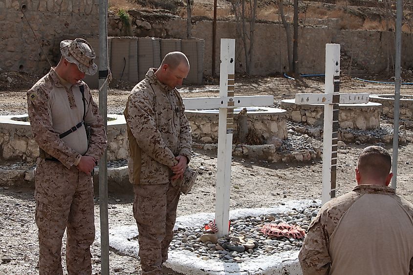 Kajaki, Afghanistan - February 4, 2012: US Marines pay tribute to fallen comrades. Editorial credit: GoodAndy45 / Shutterstock.com