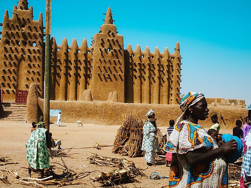 Timbuktu, Mali: Women selling wood at a bustling town market.