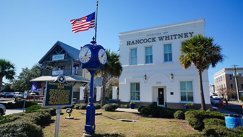 Famous bank building and old clock on Main Street in Bay of St. Louis, Mississippi on a December morning