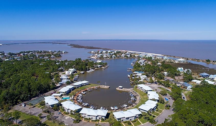 Small boat harbor at Dauphin Island, Alabama on a clear day with blue skies