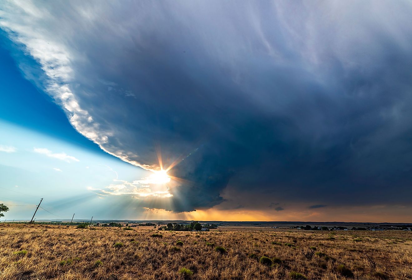 Large, powerful tornadic supercell storm moving over the Great Plains during sunset, setting the stage for the formation of tornados across Tornado Alley.