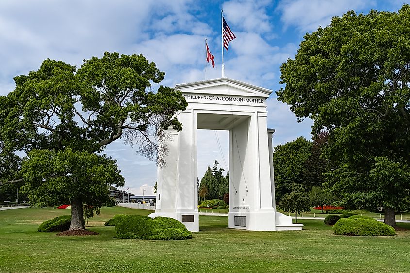 The gate monument at Peace Arch Park on the USA-Canada border in Blaine, Washington. Image Credit Elena_Alex_Ferns via Shutterstock.