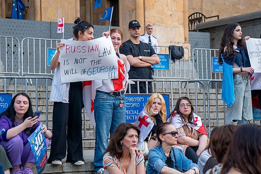 Georgian women protest on Rustaveli Avenue in Tbilisi, Georgia, against a law adopted in parliament. Image Credit k_samurkas via Shutterstock.